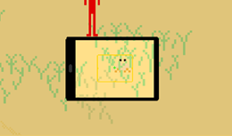 Modo de fotografia do jogo Litorália, fotografando uma Guaruçá (maria-farinha) na areia entre algumas gramas,